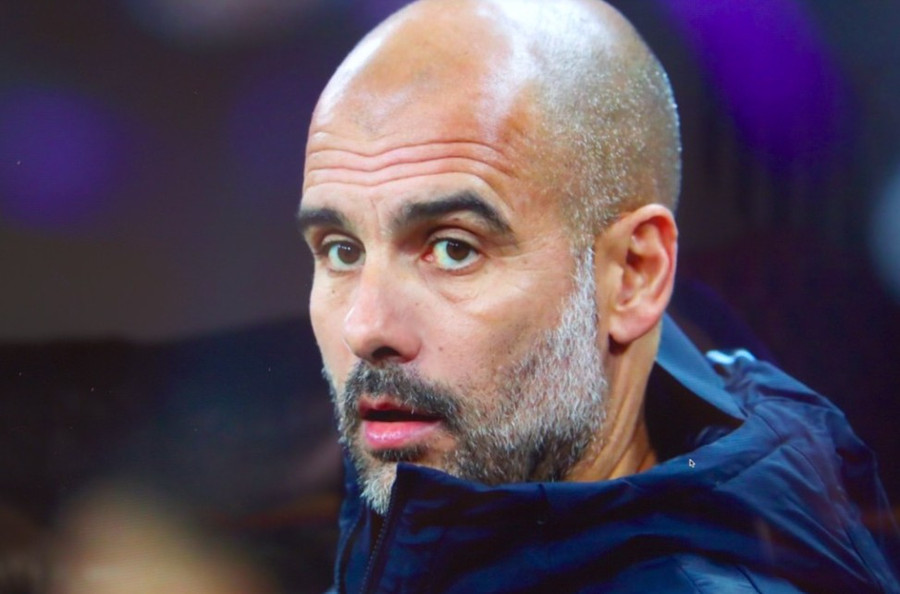 Pep Guardiola Looking Down